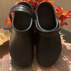 Crocs size 11 womens size 9 mens clog style slip ons. New black